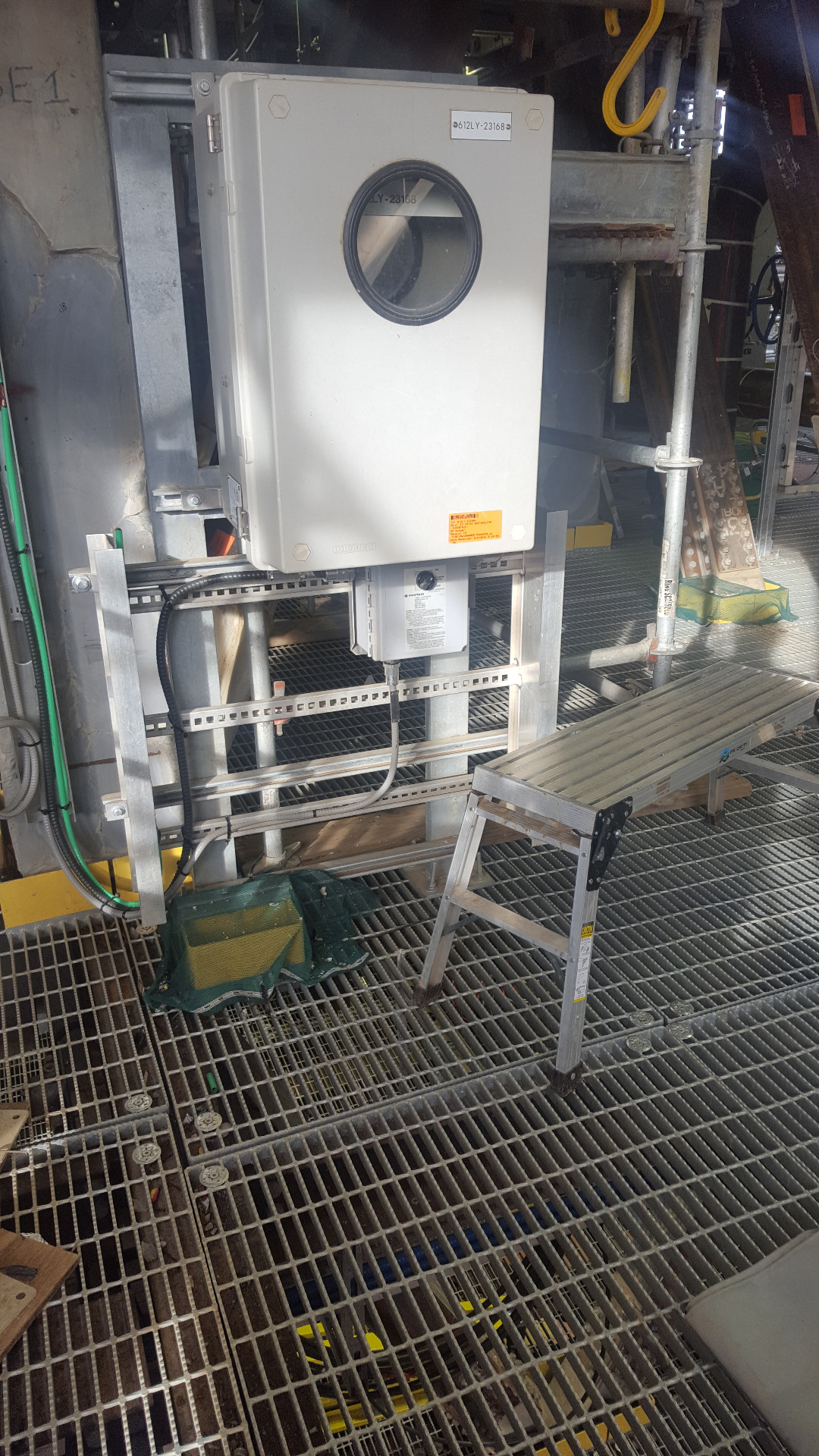 Industrial control enclosure installed on grated platform